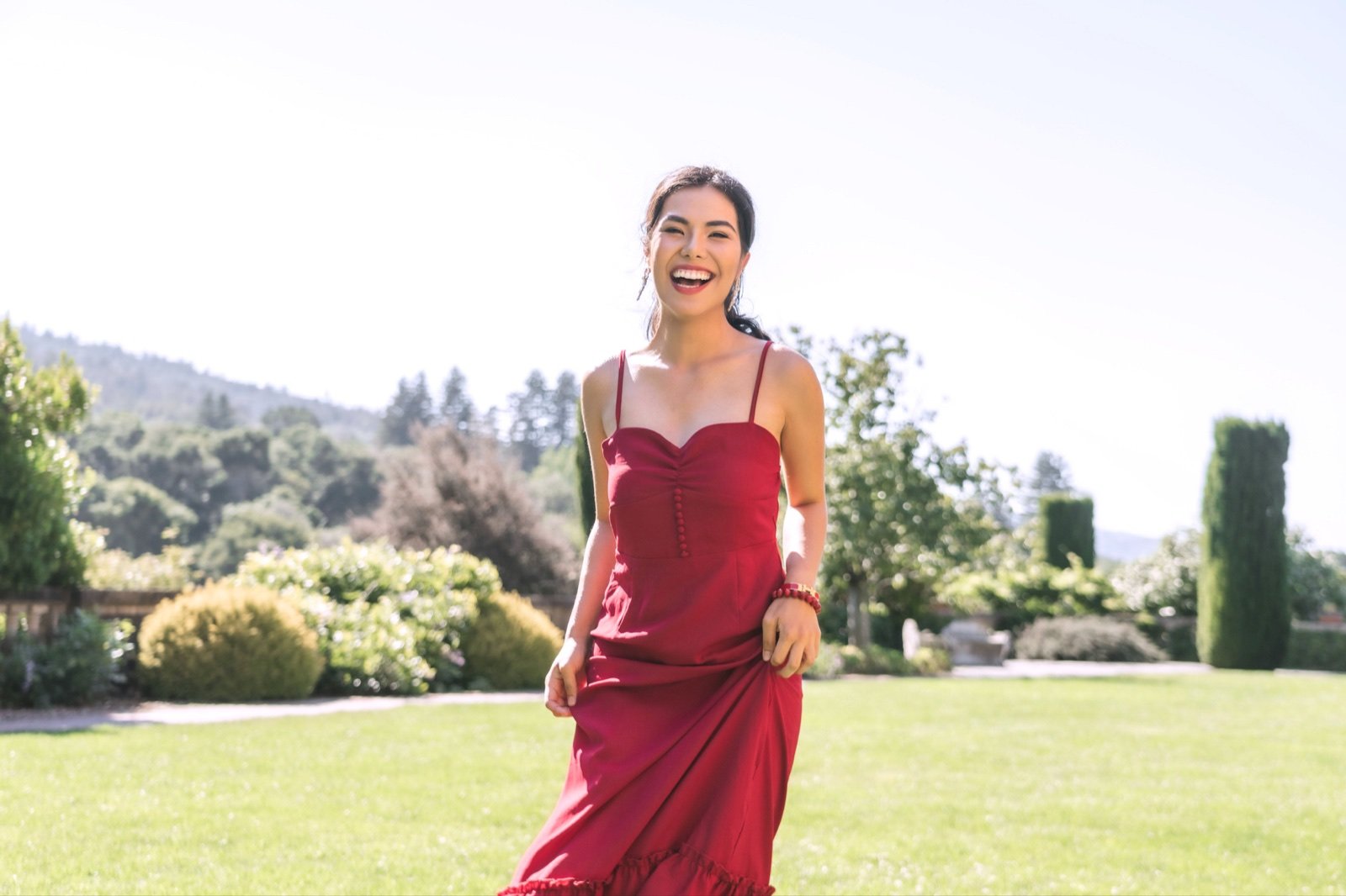 Dorothy in a red dress in a garden
