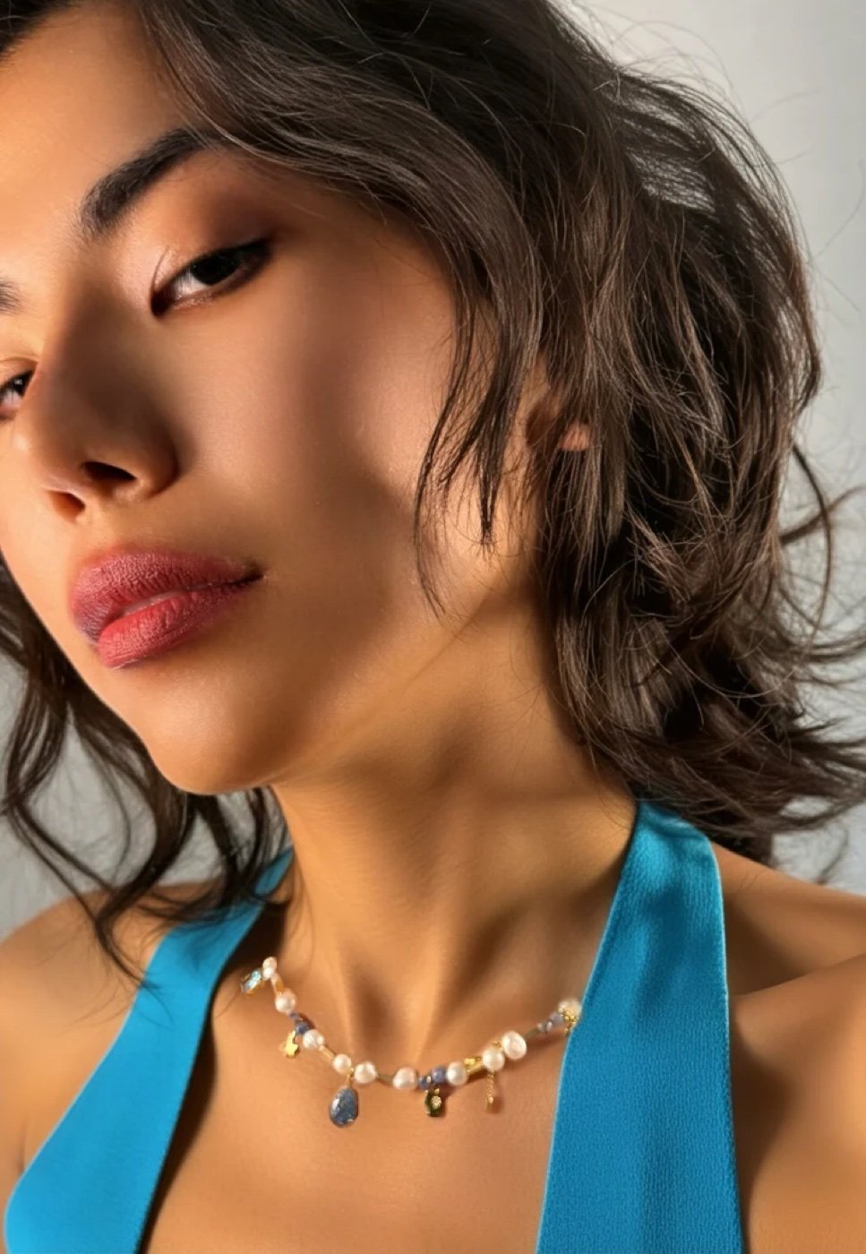 Pearl charm necklace, worn