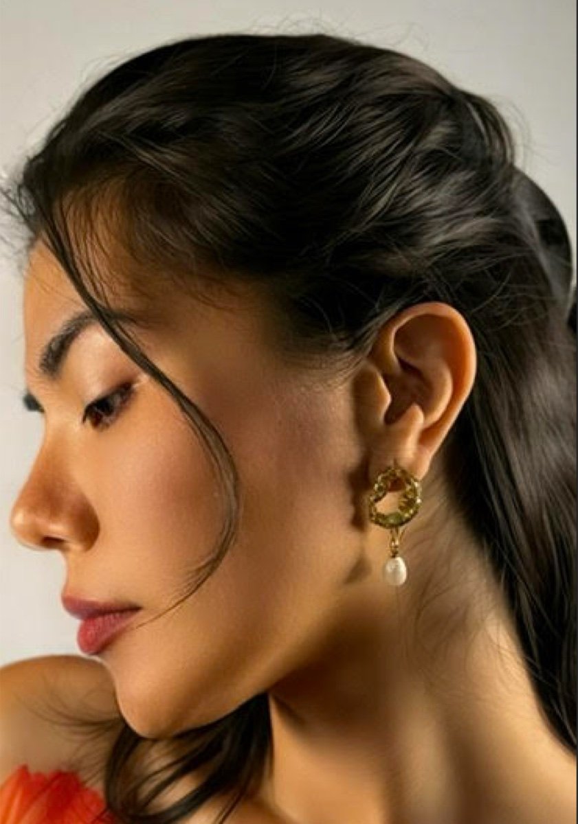 Cordelia earrings in gold, worn
