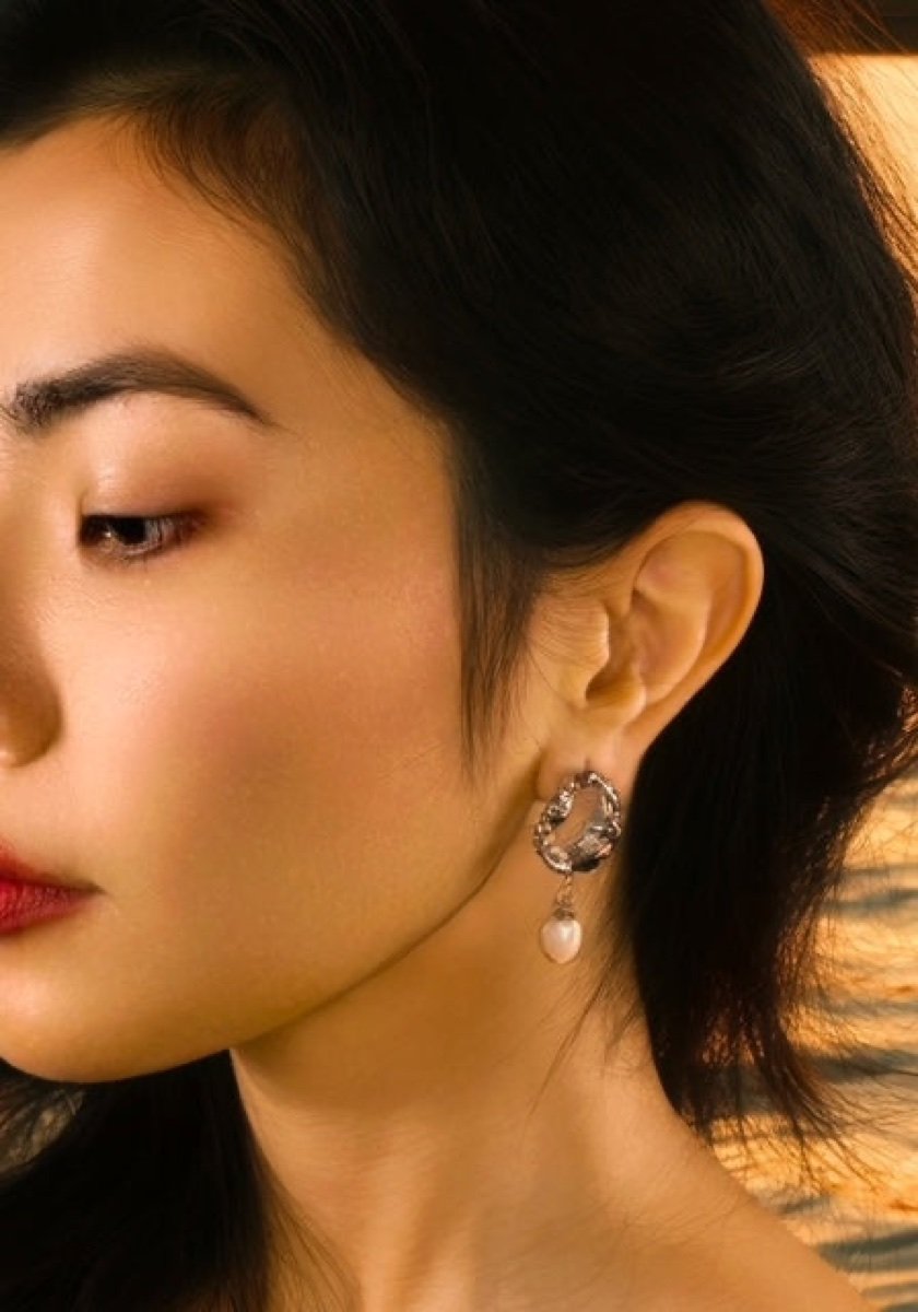 Cordelia earrings in silver, worn